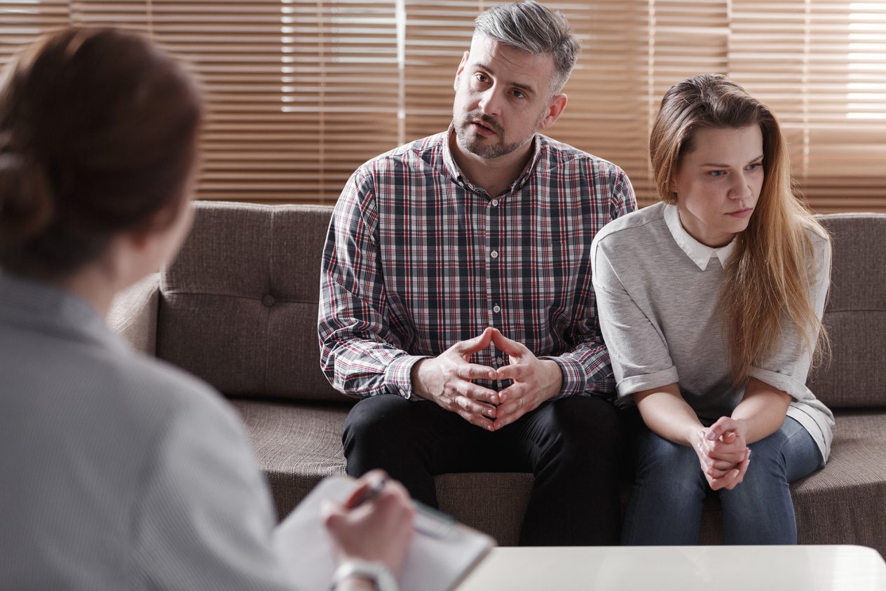 Depressed woman and husband